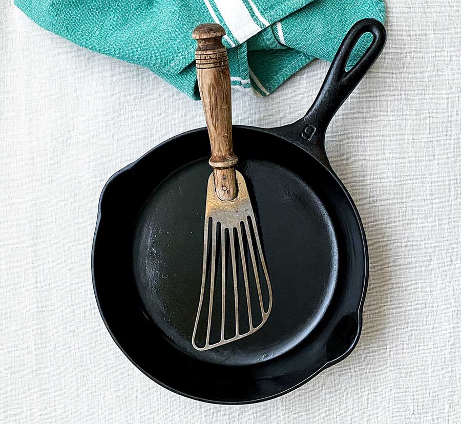 Cast iron pan on cotton tablecloth