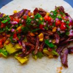 Traditional colombian burrito filling with beef and pico de gallo